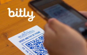 Bitly logo white over an image background